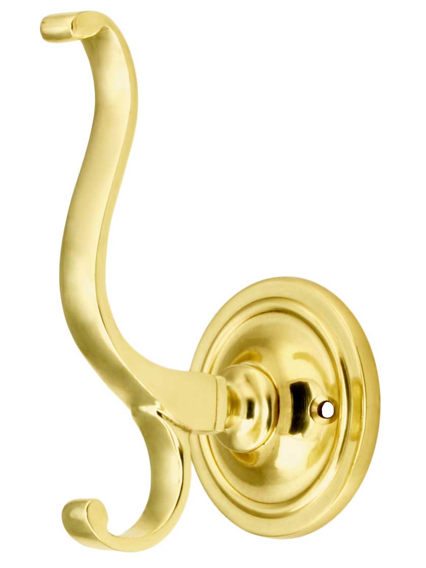 Solid Brass 4 1/2 inch Fancy Double Coat Hook With 2 1/4 inch Mounting Rosette in Polished Brass.
